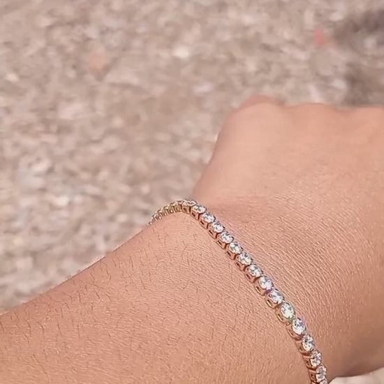 Close up of 18K gold plated tennis bracelet showing cubic zirconia detail"