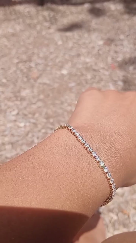 Close up of 18K gold plated tennis bracelet showing cubic zirconia detail"